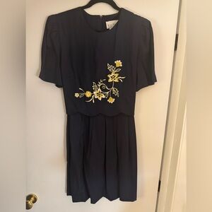 Vintage navy blue dress with flower detailing.